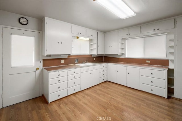 1756 6th St, Los Osos, CA 93402 - kitchen featuring open shelves, white cabinetry, and light wood-type flooring
