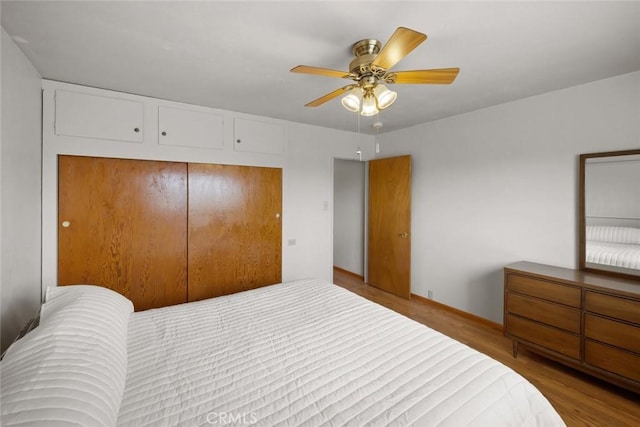 1756 6th St, Los Osos, CA 93402 - bedroom featuring a closet, wood finished floors, and a ceiling fan
