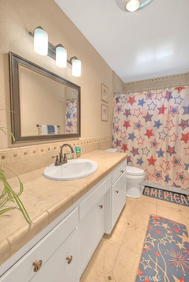 1242 2nd Pl, Calimesa, CA 92320 - bathroom featuring vanity, tile patterned flooring, tasteful backsplash, and a shower with shower curtain