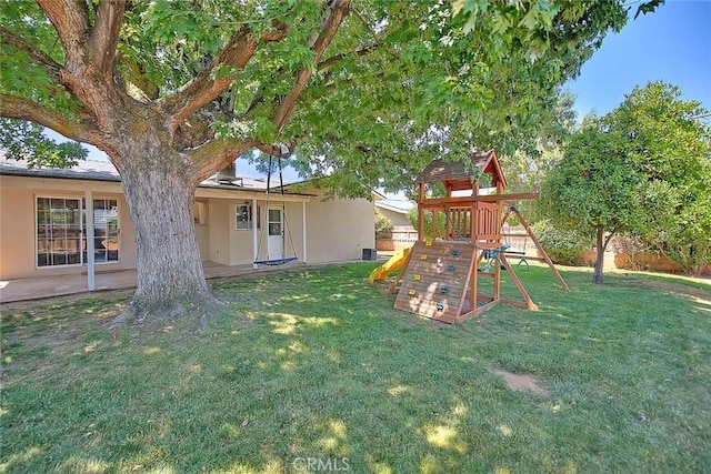 1242 2nd Pl, Calimesa, CA 92320 - view of green lawn featuring a playground