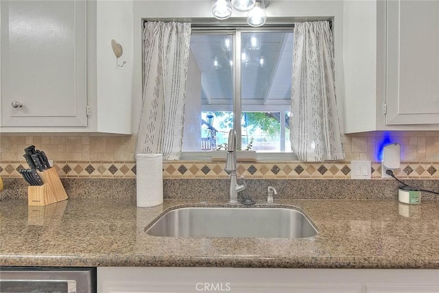 1242 2nd Pl, Calimesa, CA 92320 - kitchen with white cabinetry, light stone counters, and decorative backsplash