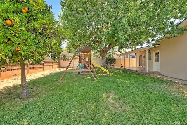 1242 2nd Pl, Calimesa, CA 92320 - fenced backyard featuring a playground