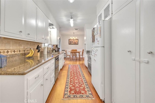 1242 2nd Pl, Calimesa, CA 92320 - kitchen with freestanding refrigerator, tasteful backsplash, white cabinetry, and light wood finished floors