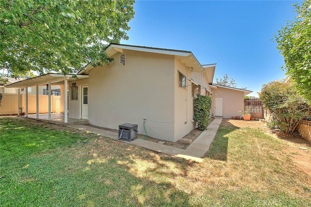 1242 2nd Pl, Calimesa, CA 92320 - back of house featuring stucco siding and a fenced backyard