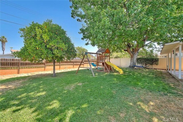 1242 2nd Pl, Calimesa, CA 92320 - fenced backyard with a playground