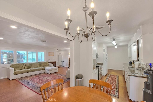 1242 2nd Pl, Calimesa, CA 92320 - dining area with light wood-type flooring, recessed lighting, and a chandelier