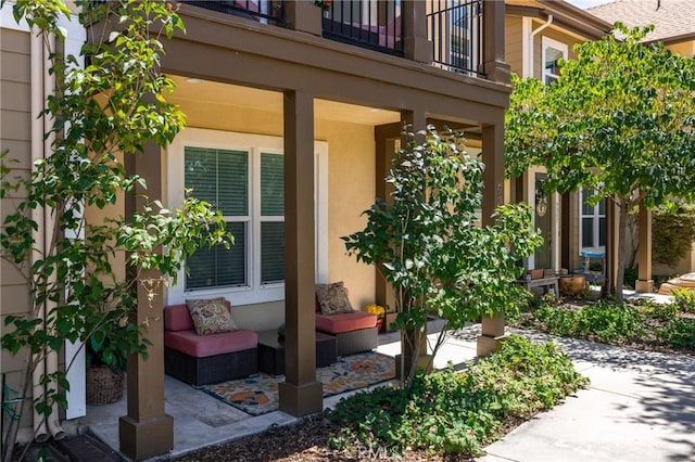 9359 Ranada Cir, Atascadero, CA 93422 - doorway to property featuring an outdoor hangout area, a balcony, and stucco siding