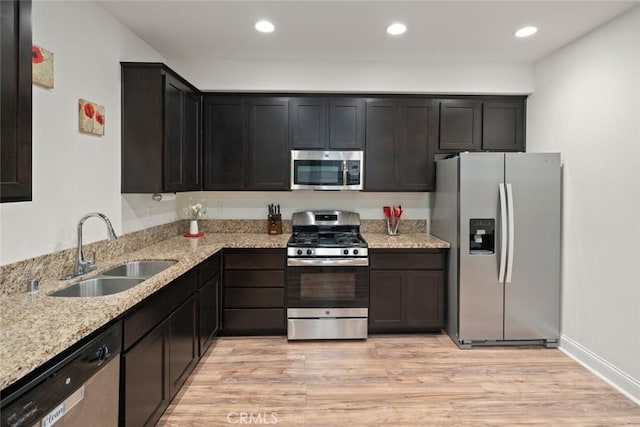 9359 Ranada Cir, Atascadero, CA 93422 - kitchen featuring stainless steel appliances, light stone counters, light wood-style flooring, and recessed lighting