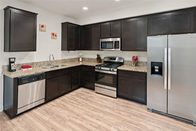 9359 Ranada Cir, Atascadero, CA 93422 - kitchen featuring stainless steel appliances, light wood-style floors, recessed lighting, and light stone counters