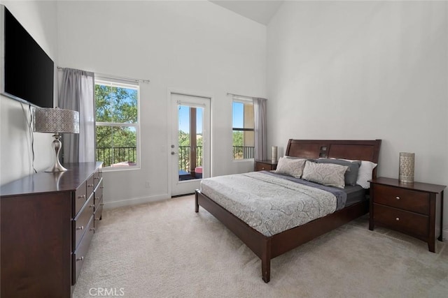 9359 Ranada Cir, Atascadero, CA 93422 - bedroom with access to outside, light carpet, and high vaulted ceiling