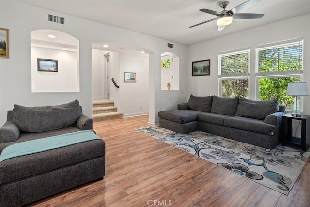 9359 Ranada Cir, Atascadero, CA 93422 - living room featuring wood finished floors, ceiling fan, stairs, arched walkways, and recessed lighting