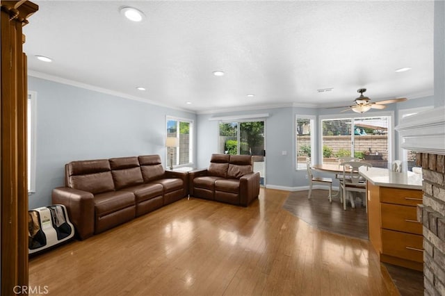 4350 Bennington Ct, Chino, CA 91710 - living area featuring a fireplace, dark wood finished floors, healthy amount of natural light, recessed lighting, and crown molding