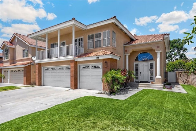 4350 Bennington Ct, Chino, CA 91710 - view of front of home with a tiled roof, an attached garage, stucco siding, driveway, and a front yard