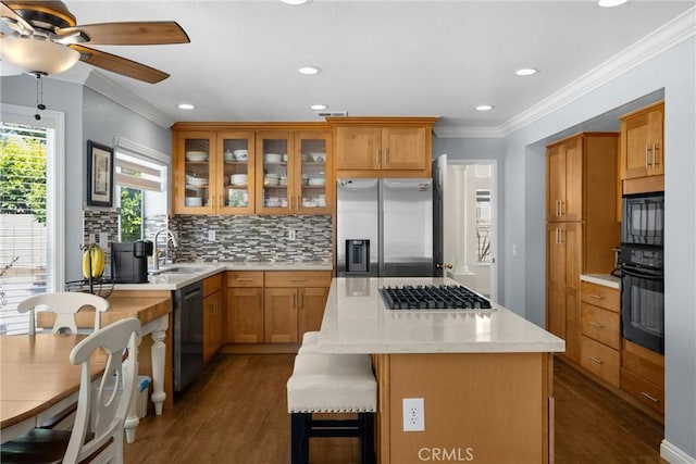 4350 Bennington Ct, Chino, CA 91710 - kitchen featuring black appliances, dark wood-style floors, crown molding, tasteful backsplash, and a kitchen island