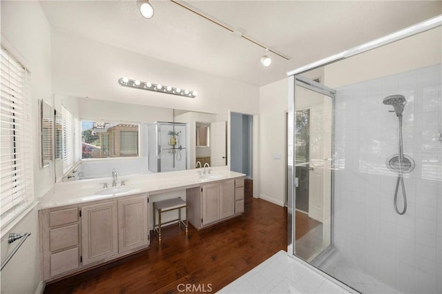 4350 Bennington Ct, Chino, CA 91710 - full bathroom with a shower stall, double vanity, wood finished floors, and rail lighting