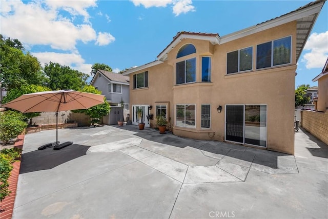 4350 Bennington Ct, Chino, CA 91710 - rear view of property with stucco siding, a fenced backyard, and a patio area