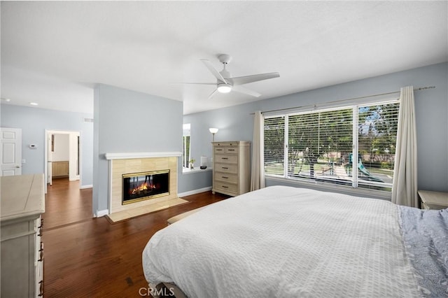4350 Bennington Ct, Chino, CA 91710 - bedroom featuring wood finished floors, a tiled fireplace, a ceiling fan, and recessed lighting
