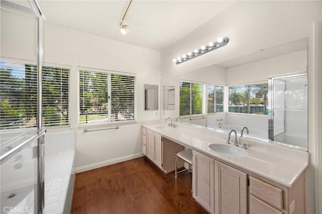 4350 Bennington Ct, Chino, CA 91710 - full bathroom featuring double vanity, a bath, wood finished floors, track lighting, and a shower with shower door