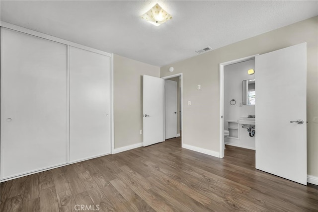 835 E 222nd St, Carson, CA 90745 - unfurnished bedroom featuring wood finished floors and a closet