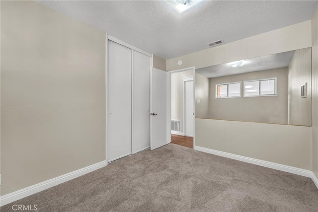 835 E 222nd St, Carson, CA 90745 - empty room with a textured ceiling and carpet flooring