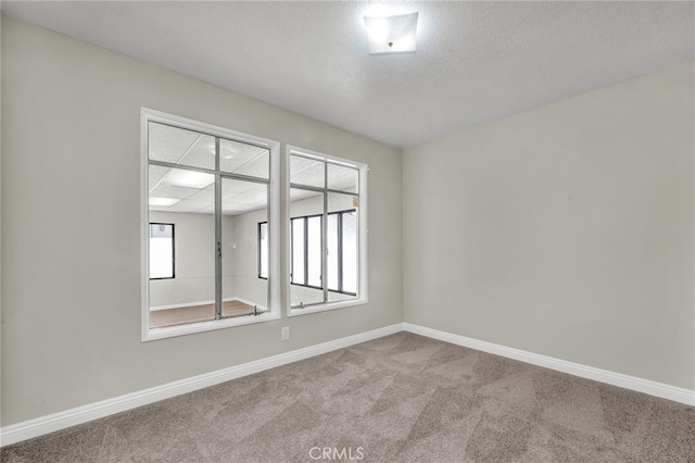 835 E 222nd St, Carson, CA 90745 - carpeted spare room featuring baseboards and a textured ceiling