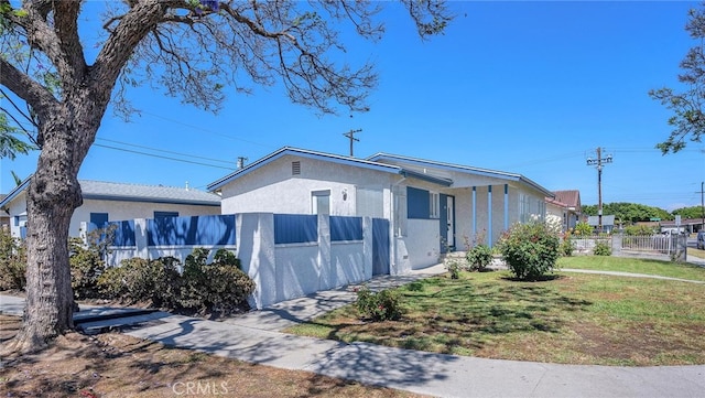 835 E 222nd St, Carson, CA 90745 - view of front facade featuring stucco siding