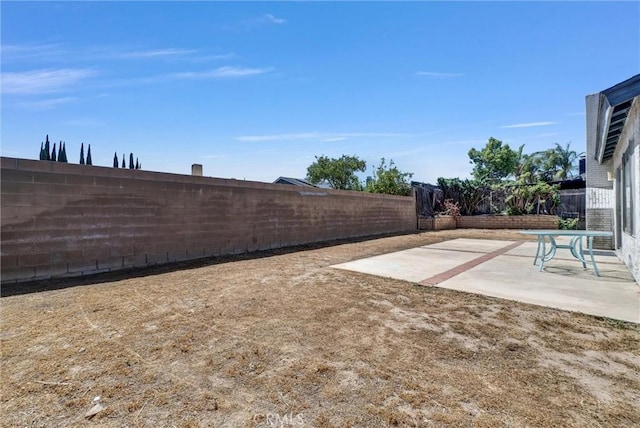 1407 Opal St, Corona, CA 92882 - fenced backyard with a patio area