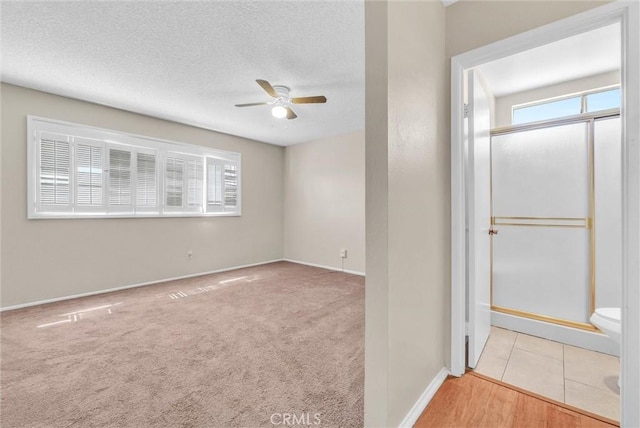 1407 Opal St, Corona, CA 92882 - carpeted spare room featuring a ceiling fan and a textured ceiling