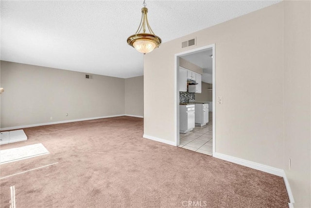 1407 Opal St, Corona, CA 92882 - unfurnished dining area featuring light carpet and baseboards