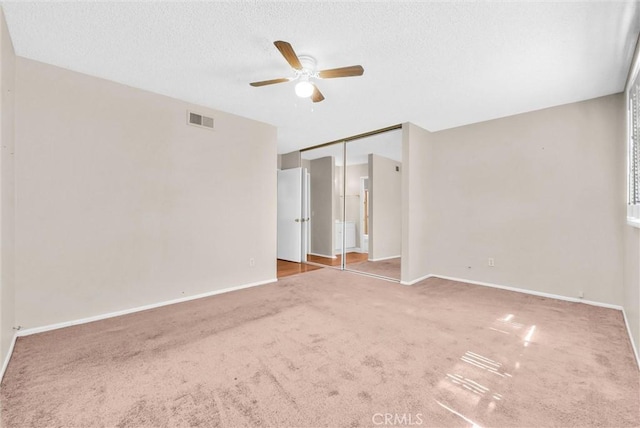 1407 Opal St, Corona, CA 92882 - spare room with carpet floors, a ceiling fan, and a textured ceiling