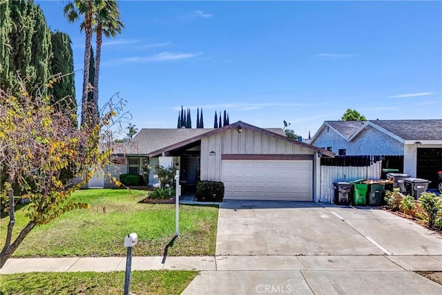 1407 Opal St, Corona, CA 92882 - view of front facade with board and batten siding, an attached garage, a front yard, and concrete driveway