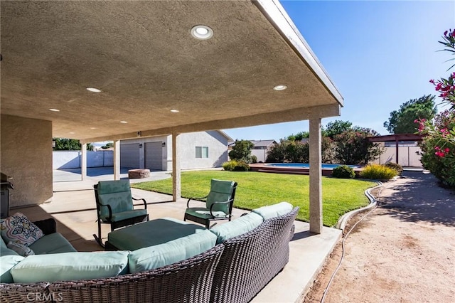 7434 Paisley Ave, Hesperia, CA 92345 - fenced backyard featuring a patio area, an outdoor living space, and a pool