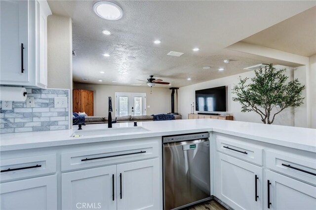 7434 Paisley Ave, Hesperia, CA 92345 - kitchen with stainless steel dishwasher, open floor plan, a ceiling fan, light countertops, and recessed lighting