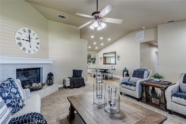 7434 Paisley Ave, Hesperia, CA 92345 - living room with lofted ceiling, carpet flooring, ceiling fan, and a fireplace