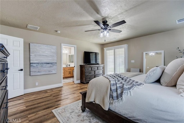 7434 Paisley Ave, Hesperia, CA 92345 - bedroom with wood finished floors, a textured ceiling, ensuite bath, and ceiling fan