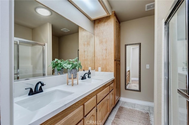 7434 Paisley Ave, Hesperia, CA 92345 - full bathroom featuring double vanity, a shower with door, and tile patterned floors