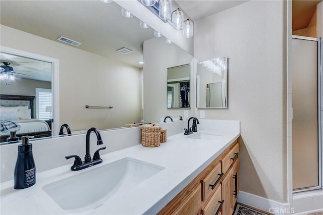 7434 Paisley Ave, Hesperia, CA 92345 - full bath with double vanity, an enclosed shower, a ceiling fan, and ensuite bath