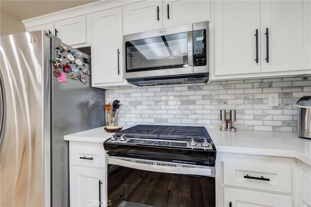 7434 Paisley Ave, Hesperia, CA 92345 - kitchen with appliances with stainless steel finishes, light countertops, and white cabinetry