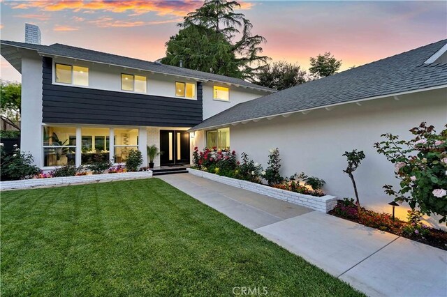 1061 Colby Cir, Thousand Oaks, CA 91362 - view of front of property with a chimney, a front lawn, a shingled roof, and stucco siding