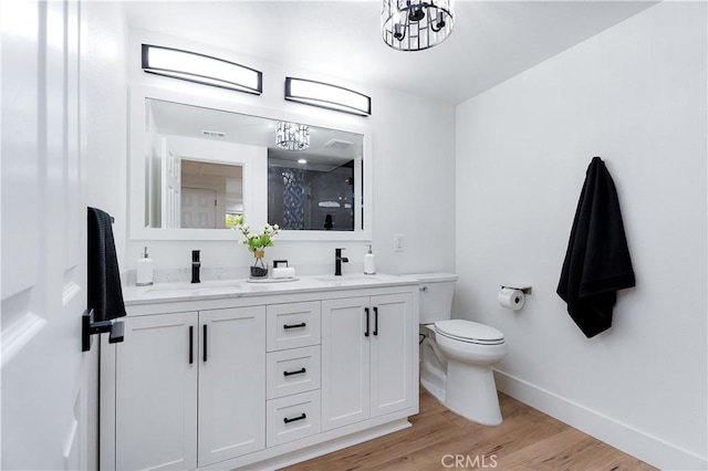 1061 Colby Cir, Thousand Oaks, CA 91362 - bathroom with a chandelier, double vanity, wood finished floors, and a shower
