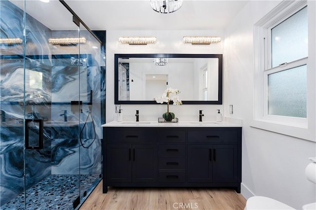1061 Colby Cir, Thousand Oaks, CA 91362 - full bathroom with a chandelier, double vanity, wood finished floors, and a marble finish shower