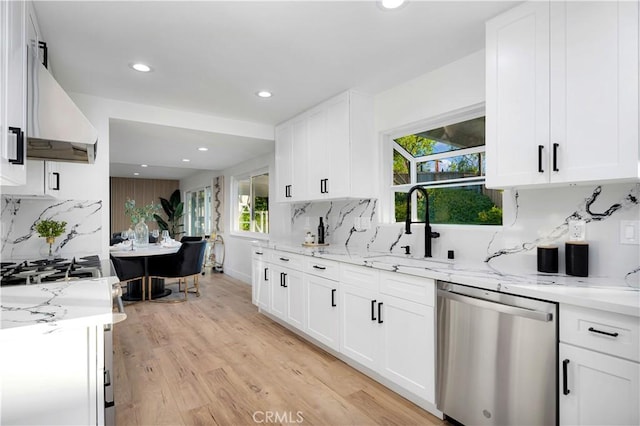 1061 Colby Cir, Thousand Oaks, CA 91362 - kitchen featuring dishwasher, exhaust hood, recessed lighting, tasteful backsplash, and light stone countertops