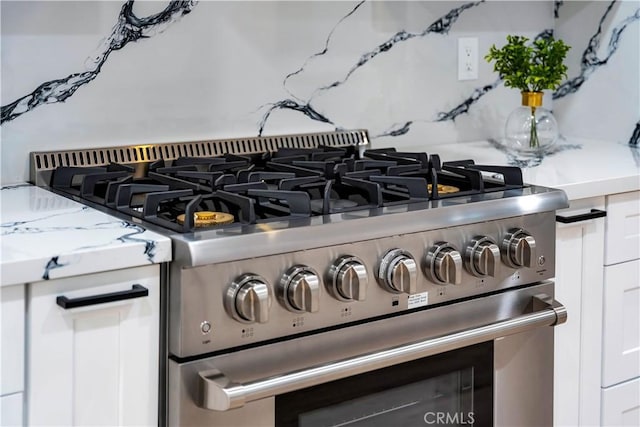 1061 Colby Cir, Thousand Oaks, CA 91362 - kitchen view of stainless steel gas range oven and decorative backsplash