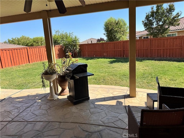 1465 Ardith Ct, Beaumont, CA 92223 - fenced backyard with ceiling fan, a patio, and a grill