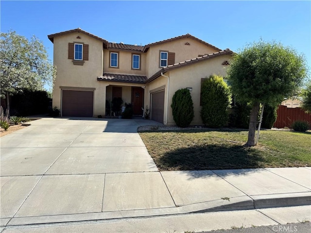 1465 Ardith Ct, Beaumont, CA 92223 - mediterranean / spanish house featuring a tiled roof, stucco siding, concrete driveway, and an attached garage