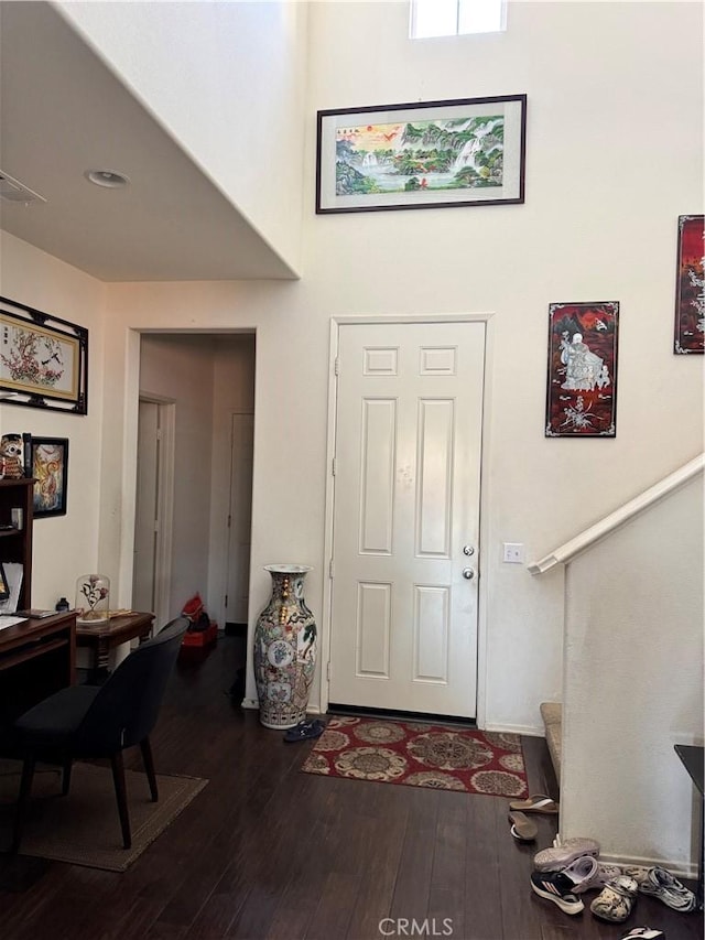 1465 Ardith Ct, Beaumont, CA 92223 - foyer entrance with dark wood finished floors and a high ceiling