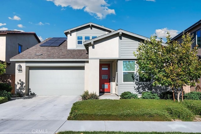 4835 S Cora Way, Ontario, CA 91762 - view of front of home with solar panels, an attached garage, concrete driveway, a shingled roof, and stucco siding