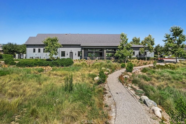 4835 S Cora Way, Ontario, CA 91762 - back of property featuring board and batten siding and a shingled roof