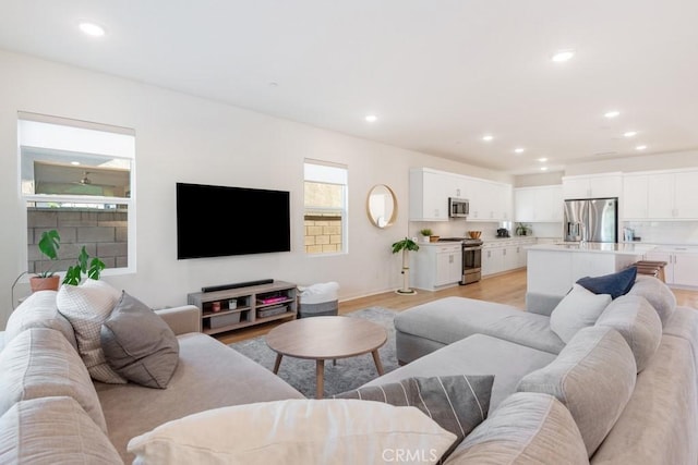 4835 S Cora Way, Ontario, CA 91762 - living area with light wood-style floors and recessed lighting
