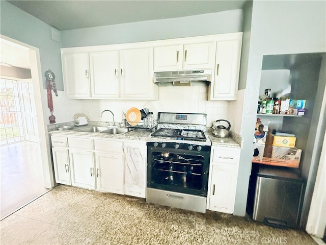 3537 Maine Ave, Baldwin Park, CA 91706 - kitchen with stainless steel range with gas cooktop, under cabinet range hood, and white cabinetry